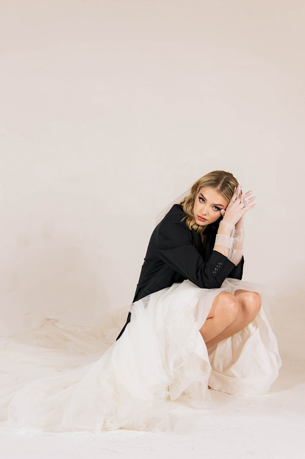 Editorial bridal portrait with tulle gown and black blazer, photographed in Duchess Boutique’s modern couture style.